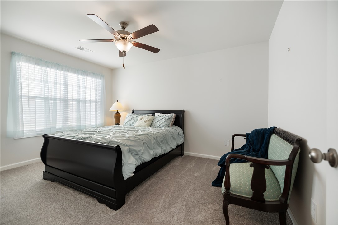 104 Village Main Anderson, SC 29621 - Photo 24 of 30 This serene bedroom offers a tranquil retreat with ample natural light.