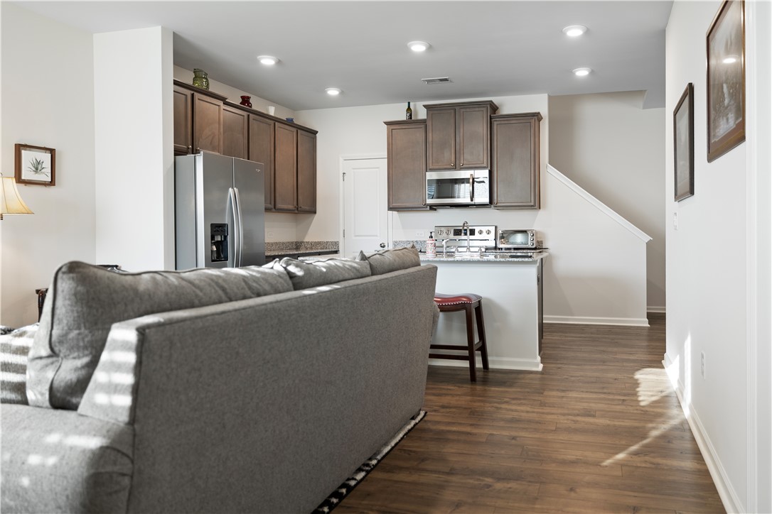 104 Village Main Anderson, SC 29621 - Photo 6 of 30 This inviting space combines kitchen and living areas, offering seamless flow and modern comfort.