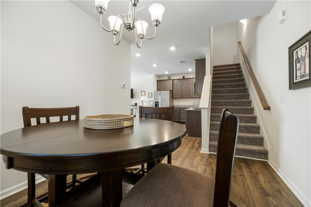104 Village Main Anderson, SC 29621 - Photo 10 of 30 This inviting dining area seamlessly connects to the kitchen, offering both functionality and comfort.