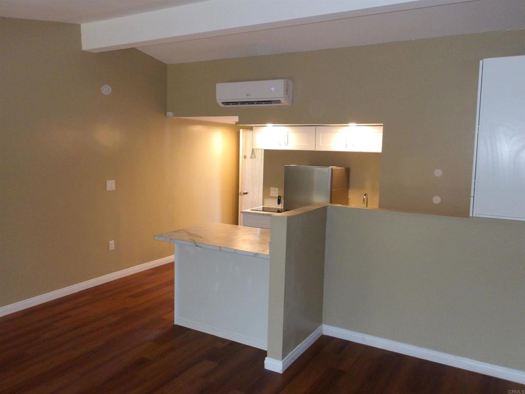 28857 Old Highway 80, Unit 3 Pine Valley, CA 91962 - Photo 2 of 15 a kitchen with granite countertop cabinets and wooden floor