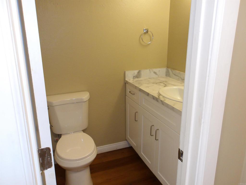 28857 Old Highway 80, Unit 3 Pine Valley, CA 91962 - Photo 7 of 15 a bathroom with a granite countertop toilet and a sink