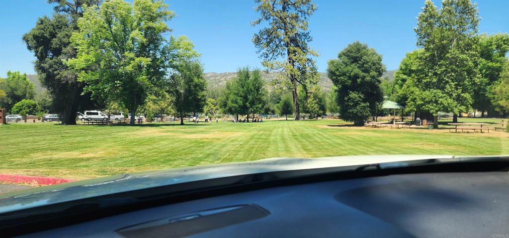 28857 Old Highway 80, Unit 3 Pine Valley, CA 91962 - Photo 9 of 15 a view of a swimming pool with a lawn chairs under an umbrella