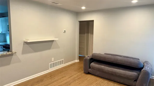 a view of livingroom with furniture and wooden floor