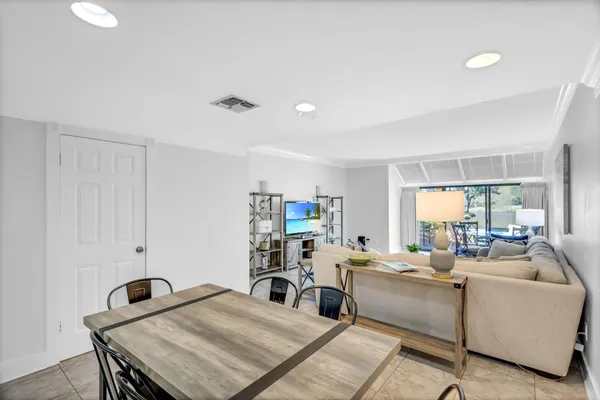 a living room with furniture and a table