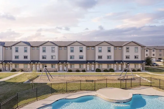 an aerial view of a house with outdoor space