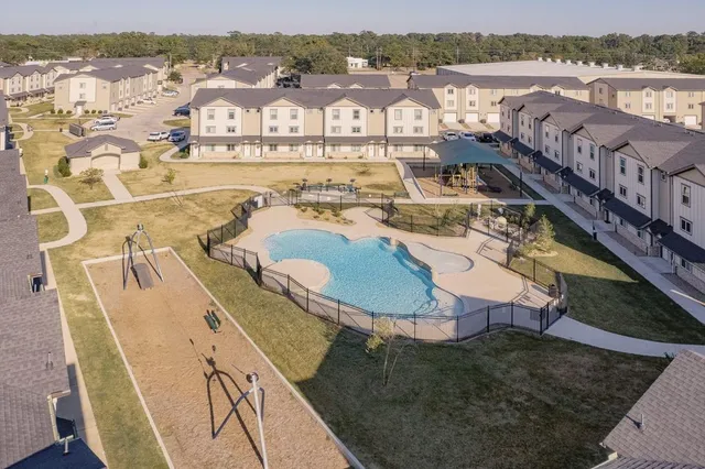 a view of a swimming pool with a lounge chairs