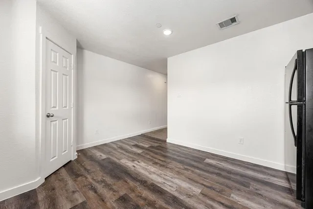 a view of hallway with wooden floor