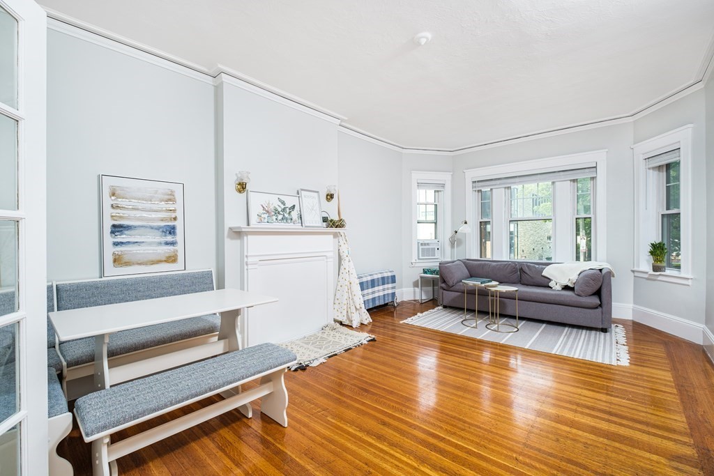 108 Washington Street, Unit 8 Boston, MA 02135 - Photo 3 of 18 a living room with furniture and a large window