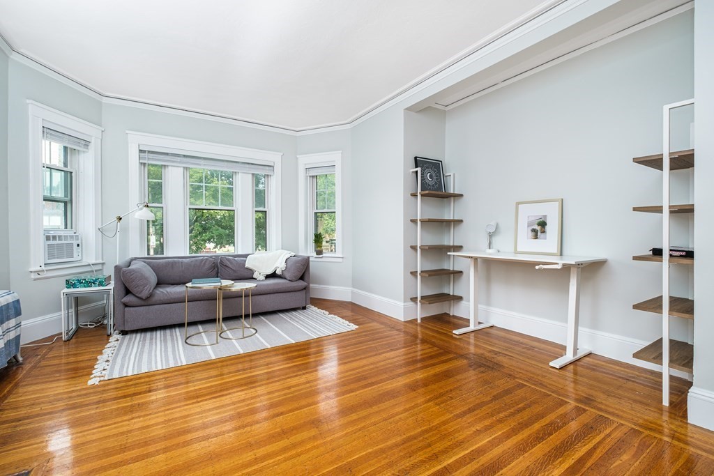 108 Washington Street, Unit 8 Boston, MA 02135 - Photo 6 of 18 a living room with furniture window and wooden floor