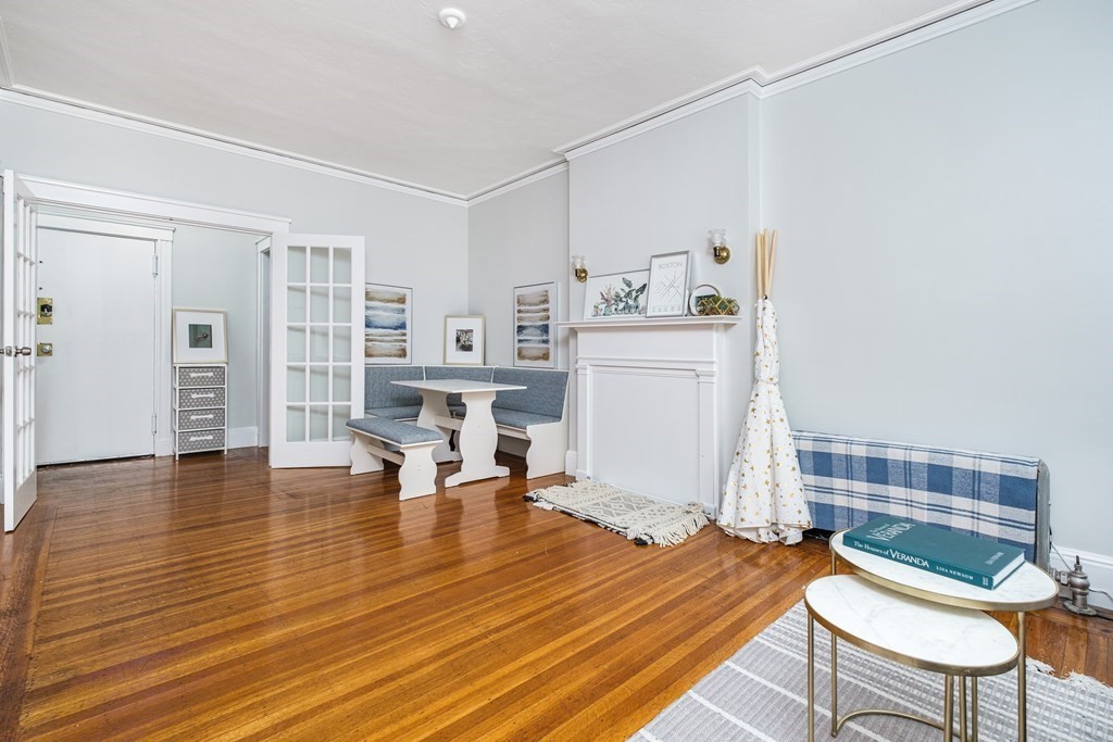 108 Washington Street, Unit 8 Boston, MA 02135 - Photo 7 of 18 a view of livingroom with furniture and wooden floor