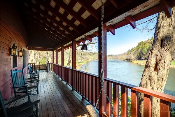 a view of balcony with wooden floor
