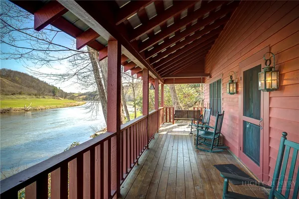 a view of a balcony with chairs