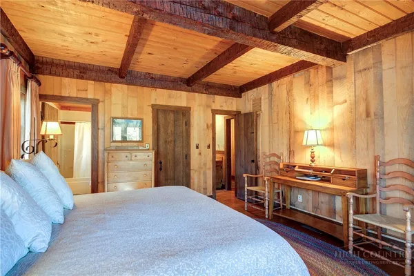 a bedroom with furniture and windows