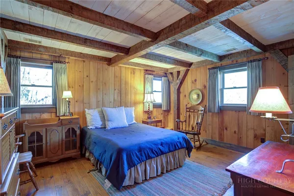 a bed room with a bed and a window