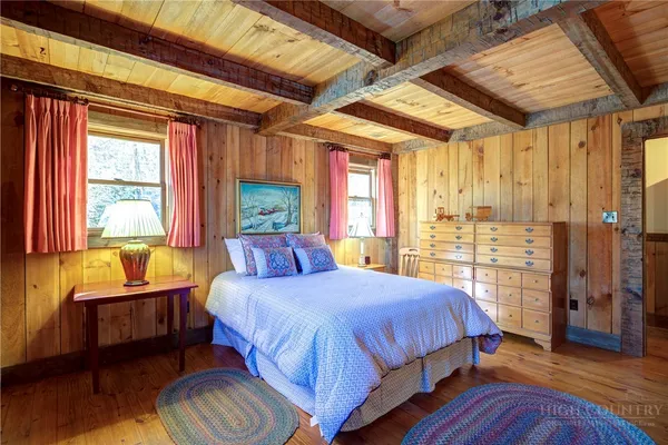 a spacious bedroom with a bed and a couch
