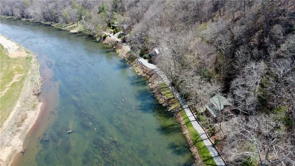 a view of a lake with a yard
