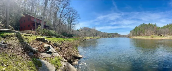 a view of a lake with houses in background