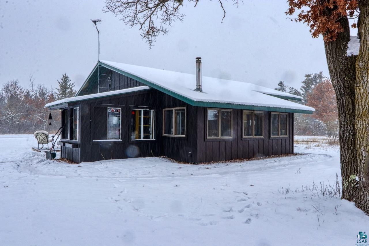 33469 No Mans Lake Road Minong, WI 54859 - Photo 7 of 38 View of snow covered house