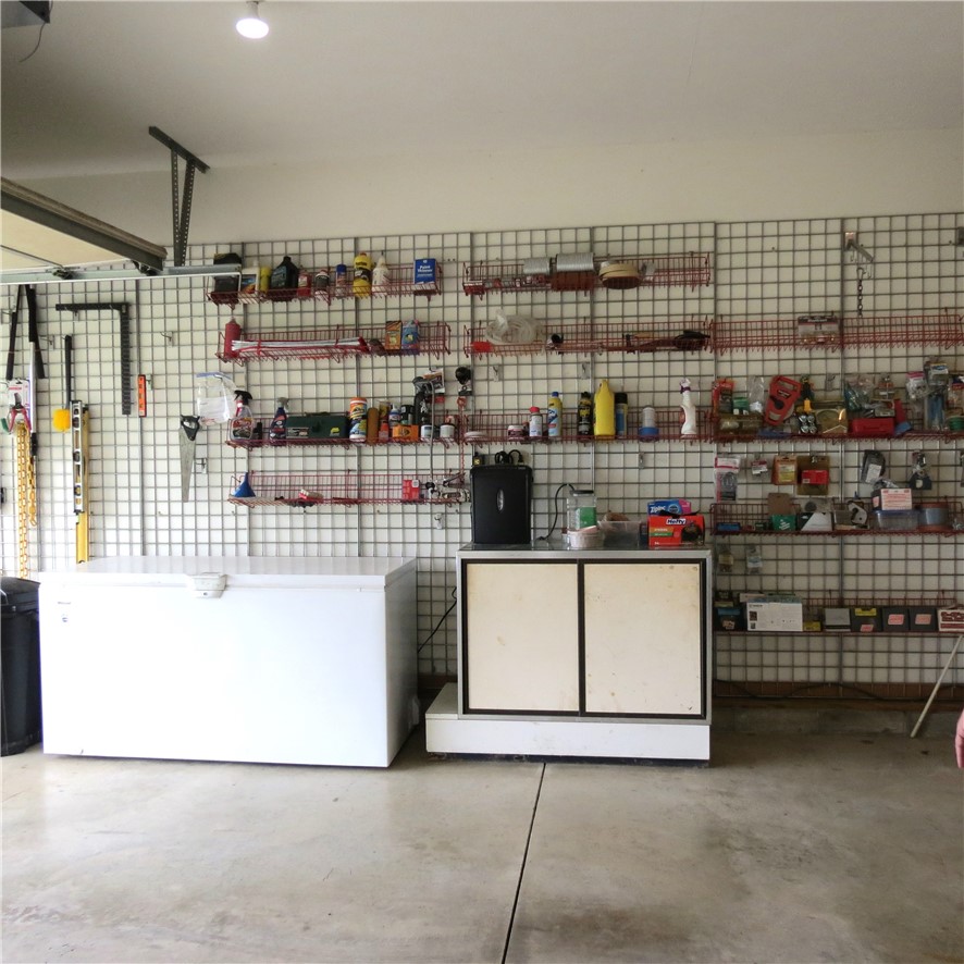 21242 Dingman-Slagle Road Pemberton, OH 45353 - Photo 18 of 33 This spacious garage offers versatile storage solutions for all your needs.