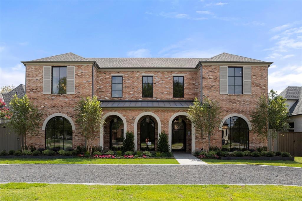 6430 Pemberton Drive Dallas, TX 75230 - Photo 1 of 1 a front view of a house with a yard and garage