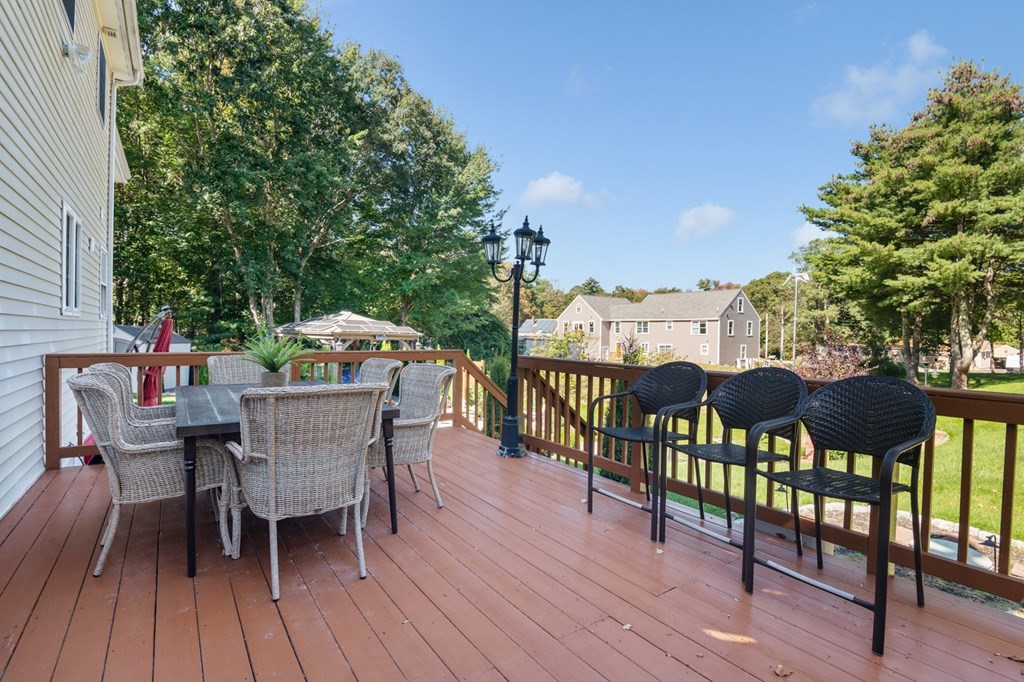 5 Michele Drive Salisbury, MA 01952 - Photo 14 of 38 a view of a roof deck with table and chairs