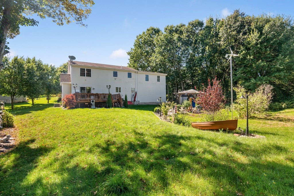 5 Michele Drive Salisbury, MA 01952 - Photo 16 of 38 a view of a house with backyard and sitting area