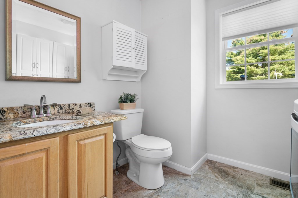 5 Michele Drive Salisbury, MA 01952 - Photo 18 of 38 a bathroom with a granite countertop toilet sink and mirror