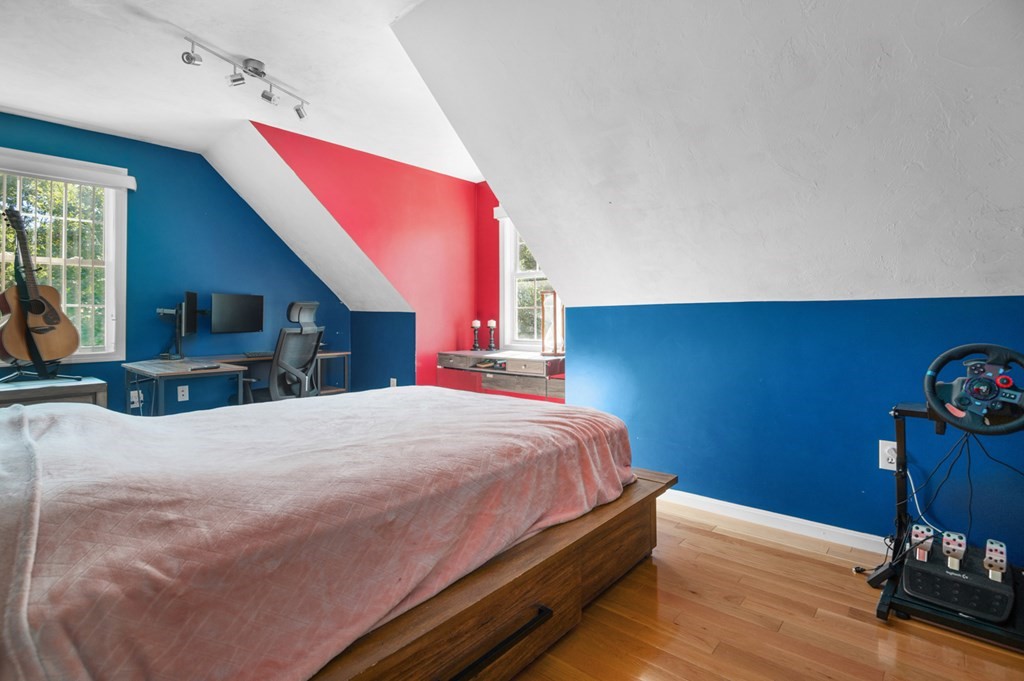 5 Michele Drive Salisbury, MA 01952 - Photo 23 of 38 a bedroom with a bed and a dresser with wooden floor