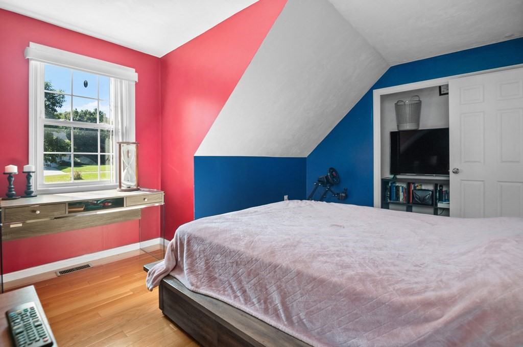 5 Michele Drive Salisbury, MA 01952 - Photo 24 of 38 a bedroom with a large bed and a flat screen tv