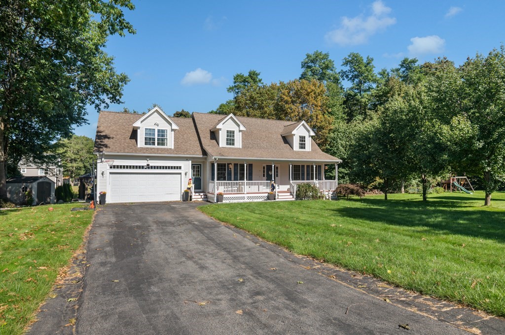 5 Michele Drive Salisbury, MA 01952 - Photo 3 of 38 a front view of a house with a garden
