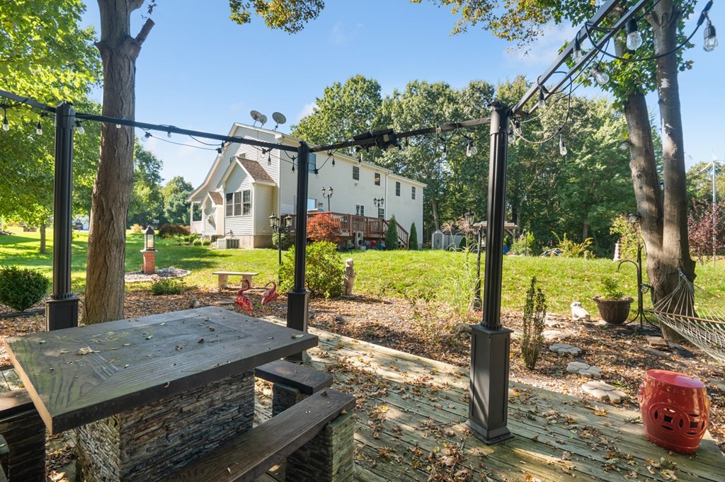 5 Michele Drive Salisbury, MA 01952 - Photo 5 of 38 a view of a yard with plants and outdoor seating