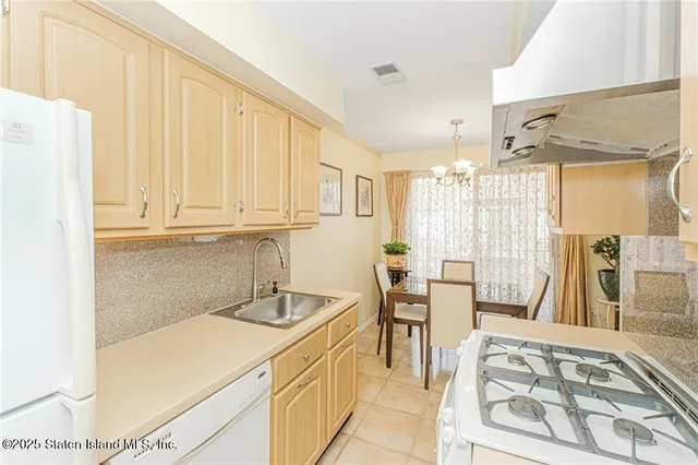 a bathroom with a sink a vanity and a toilet