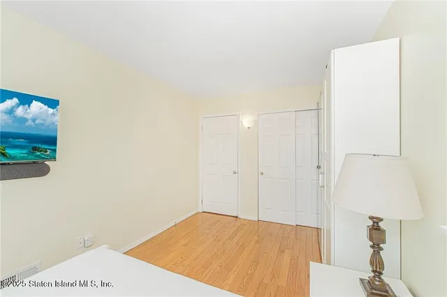 a bed room with a bed and a window