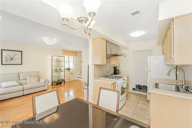 a kitchen that has a sink and a stove