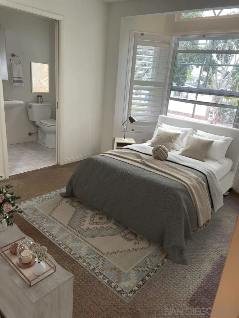 981 Cabrillo Avenue Coronado, CA 92118 - Photo 19 of 32 a bedroom with a bed and glass window