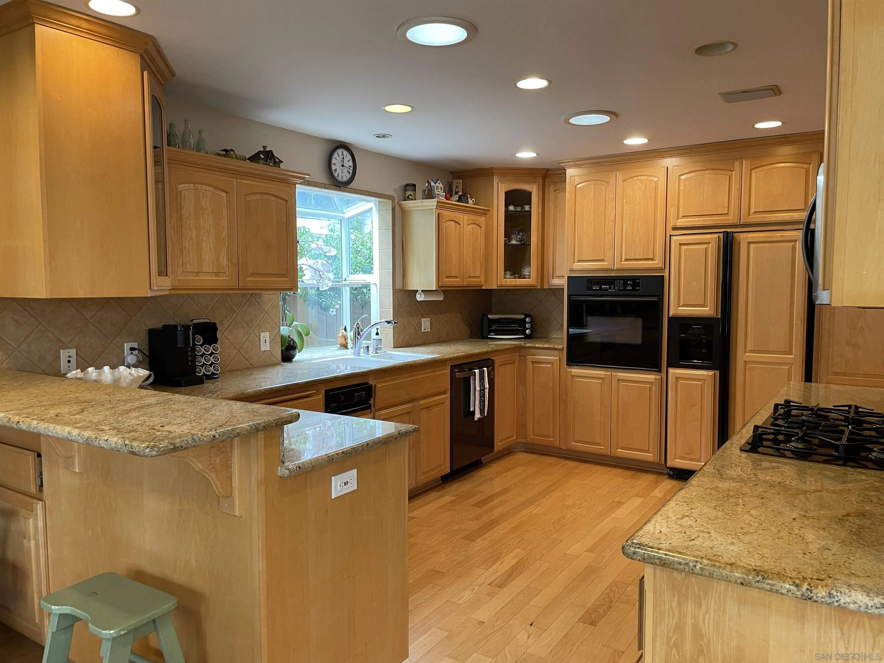 981 Cabrillo Avenue Coronado, CA 92118 - Photo 8 of 32 a kitchen with stainless steel appliances granite countertop a stove a sink and a refrigerator