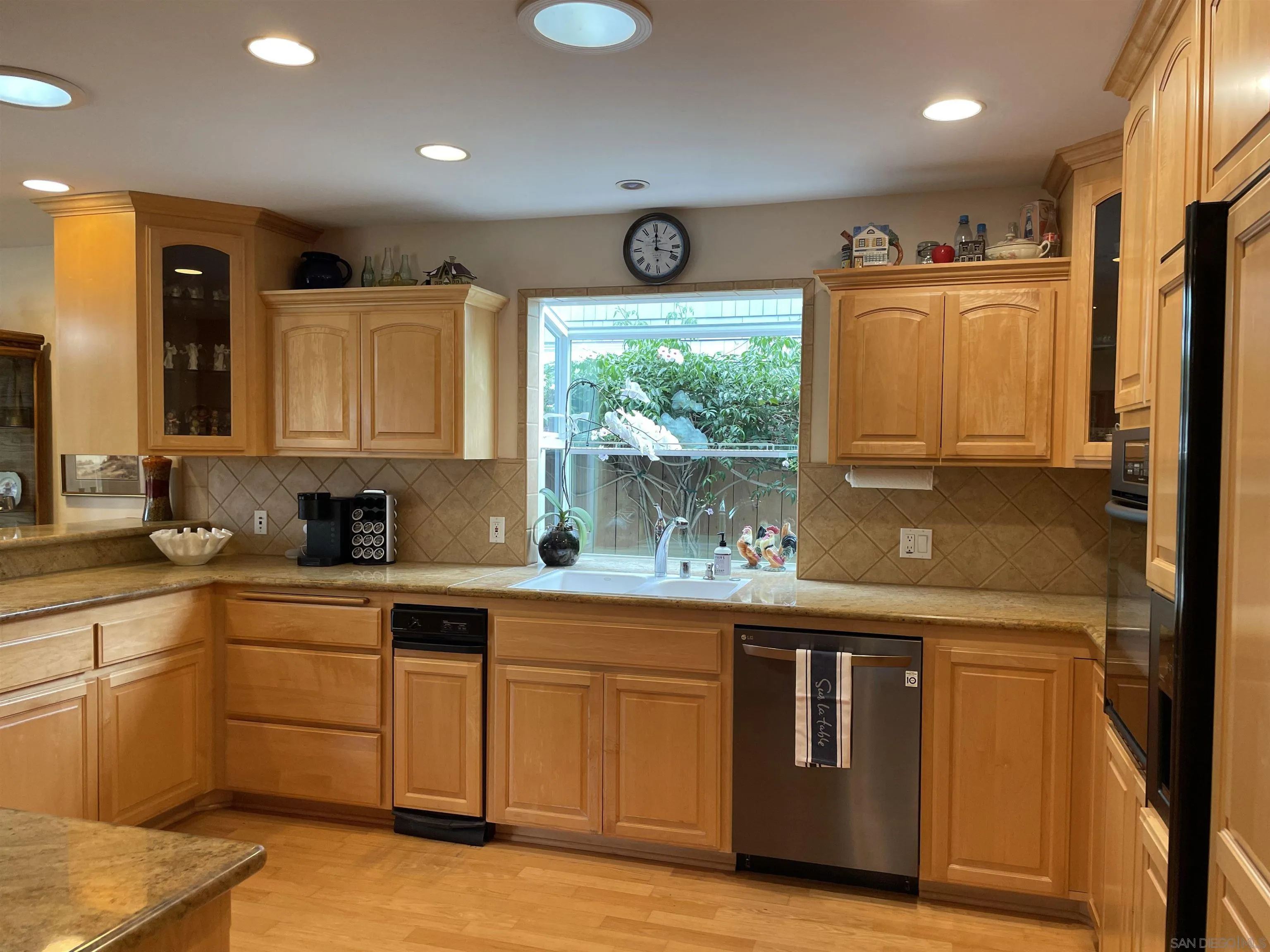 981 Cabrillo Avenue Coronado, CA 92118 - Photo 9 of 32 a kitchen with stainless steel appliances granite countertop a sink and cabinets