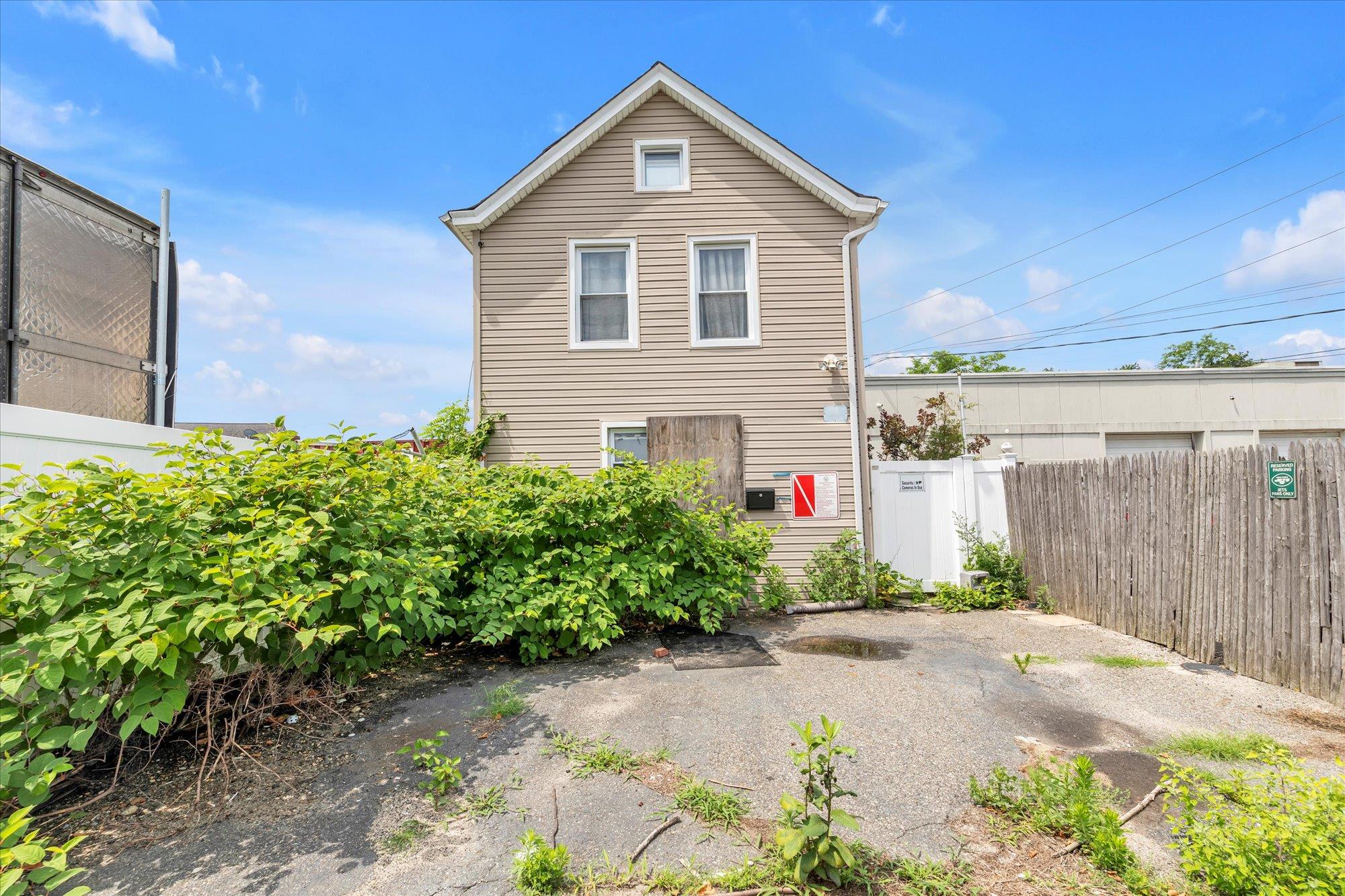 a view of a small garden in front of a house