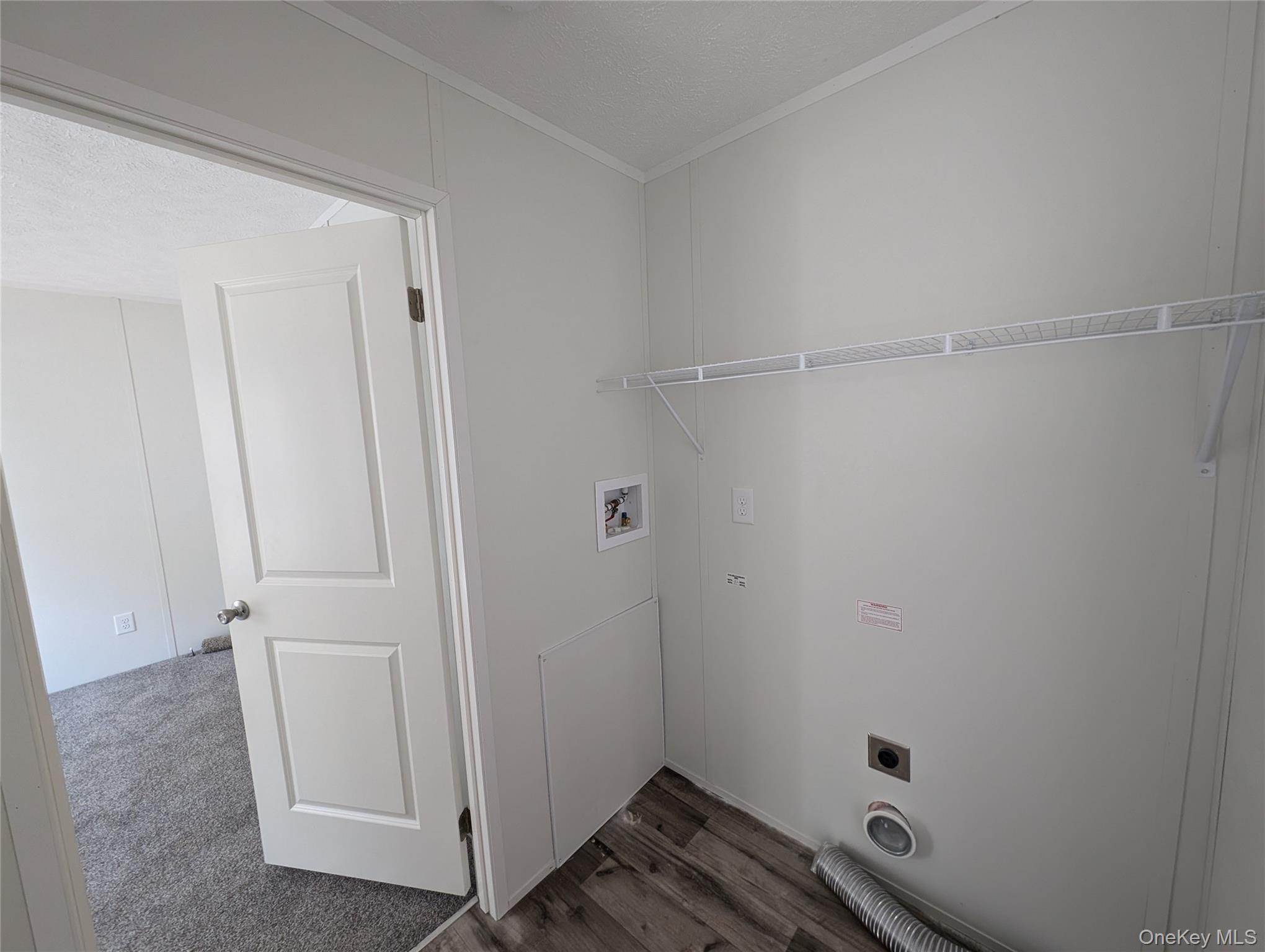 3146 Rte 9W, Unit 6A New Windsor, NY 12553 - Photo 12 of 14 Laundry area featuring crown molding, laundry area, hookup for a washing machine, hookup for an electric dryer, and dark wood-style floors