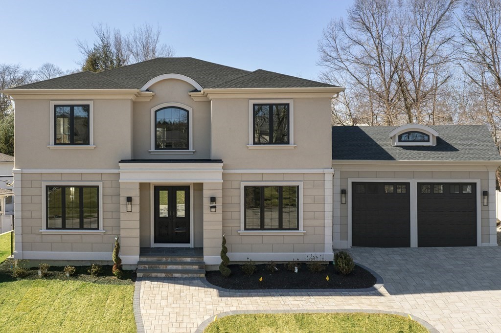 192 Evelyn Road Newton, MA 02468 - Photo 1 of 41 a front view of a house with yard