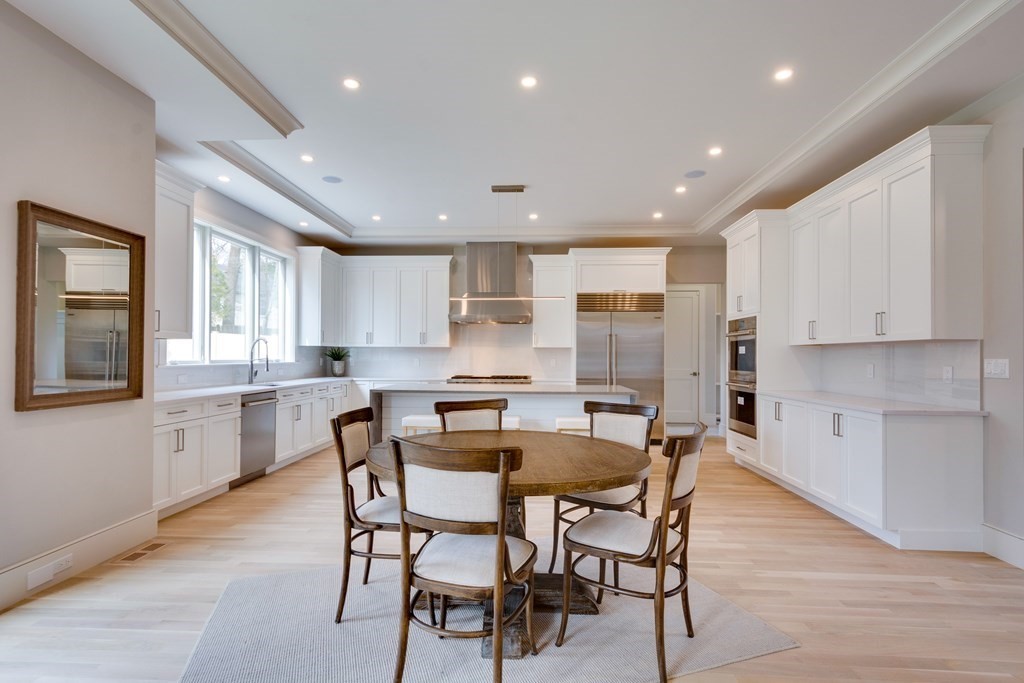 192 Evelyn Road Newton, MA 02468 - Photo 14 of 41 a kitchen with a table and chairs in it