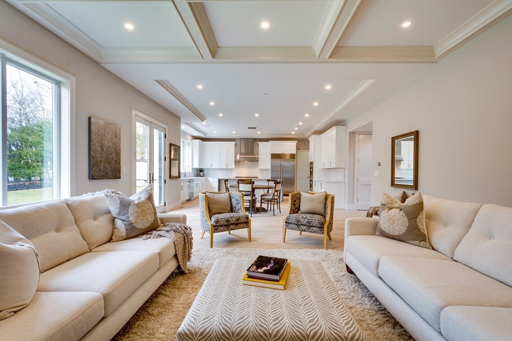 192 Evelyn Road Newton, MA 02468 - Photo 18 of 41 a living room with furniture kitchen view and a large window