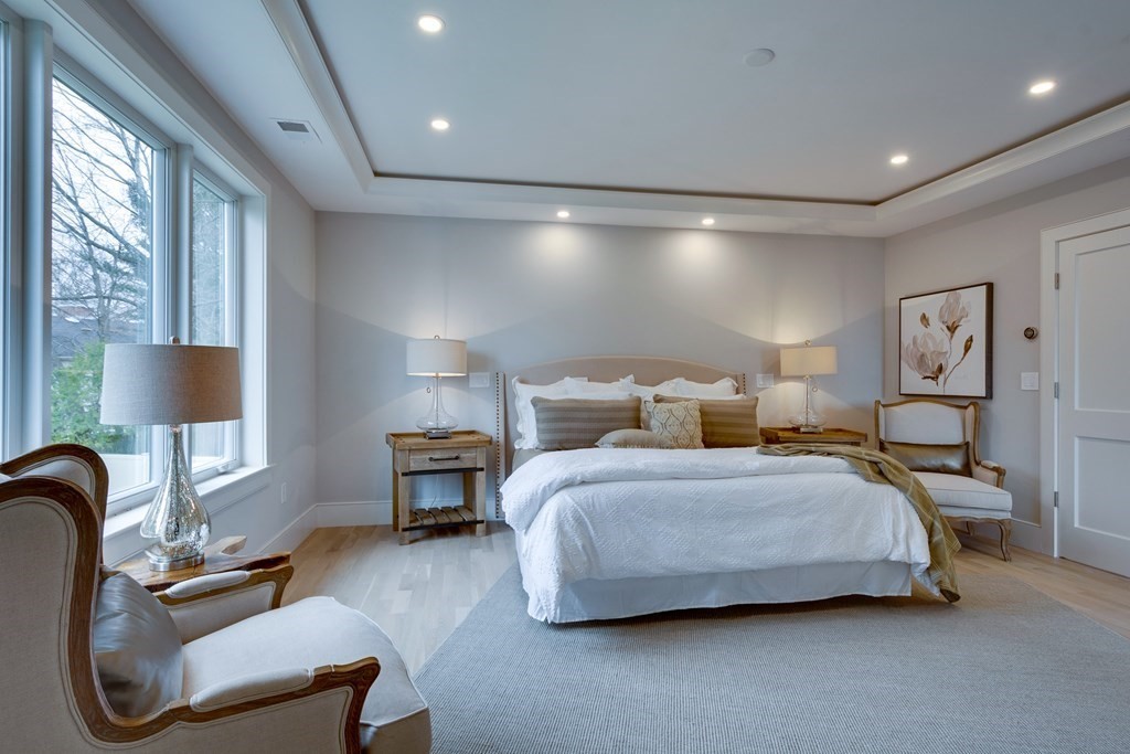 192 Evelyn Road Newton, MA 02468 - Photo 26 of 41 a bedroom with bed and a chair