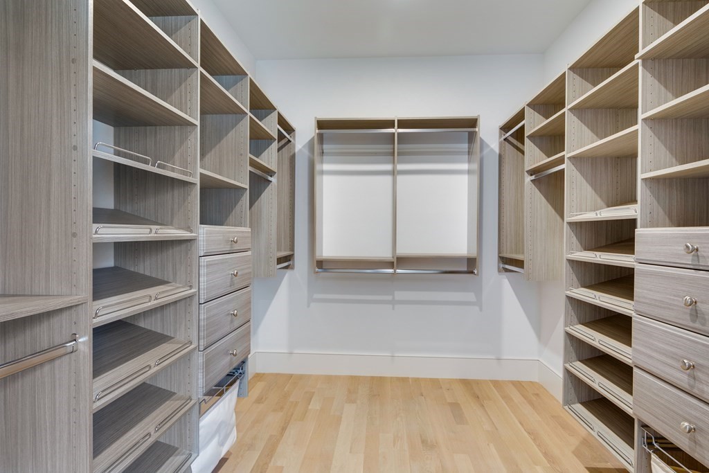 192 Evelyn Road Newton, MA 02468 - Photo 27 of 41 a view of walk in closet with empty racks