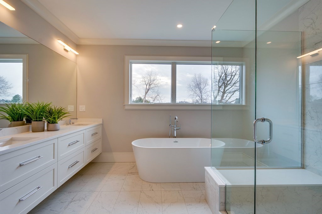 192 Evelyn Road Newton, MA 02468 - Photo 28 of 41 a bathroom with a white tub sitting next to a window