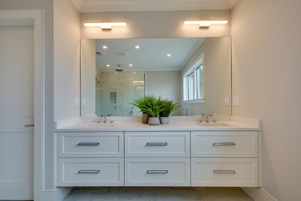 192 Evelyn Road Newton, MA 02468 - Photo 30 of 41 a bathroom with a double vanity sink mirror and next to a window