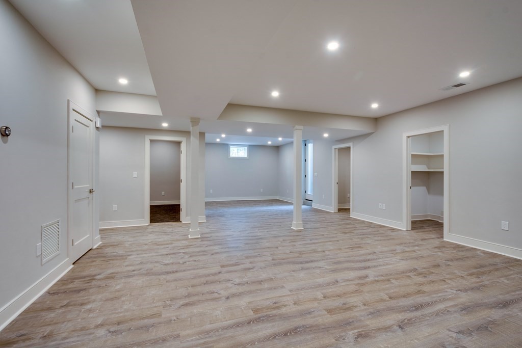 192 Evelyn Road Newton, MA 02468 - Photo 32 of 41 a view of an empty room with wooden floor