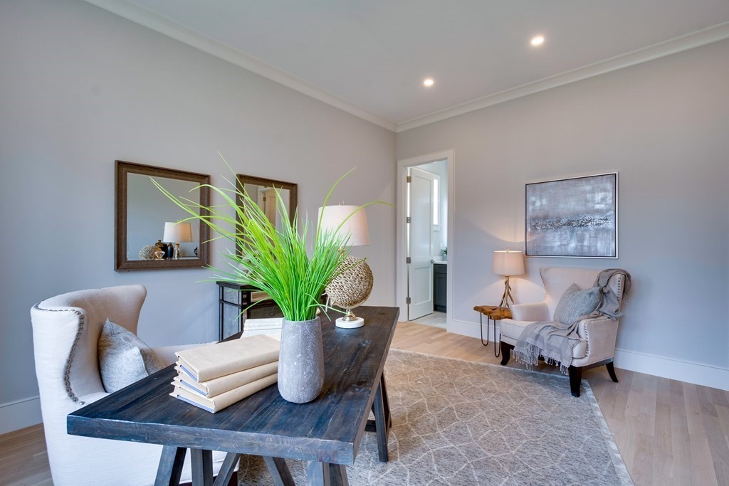 192 Evelyn Road Newton, MA 02468 - Photo 6 of 41 a living room with furniture potted plant and a potted plant