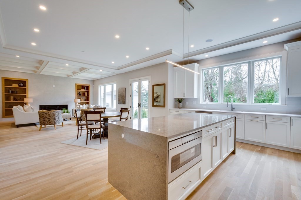 192 Evelyn Road Newton, MA 02468 - Photo 7 of 41 a large kitchen with stainless steel appliances granite countertop a large center island and a sink