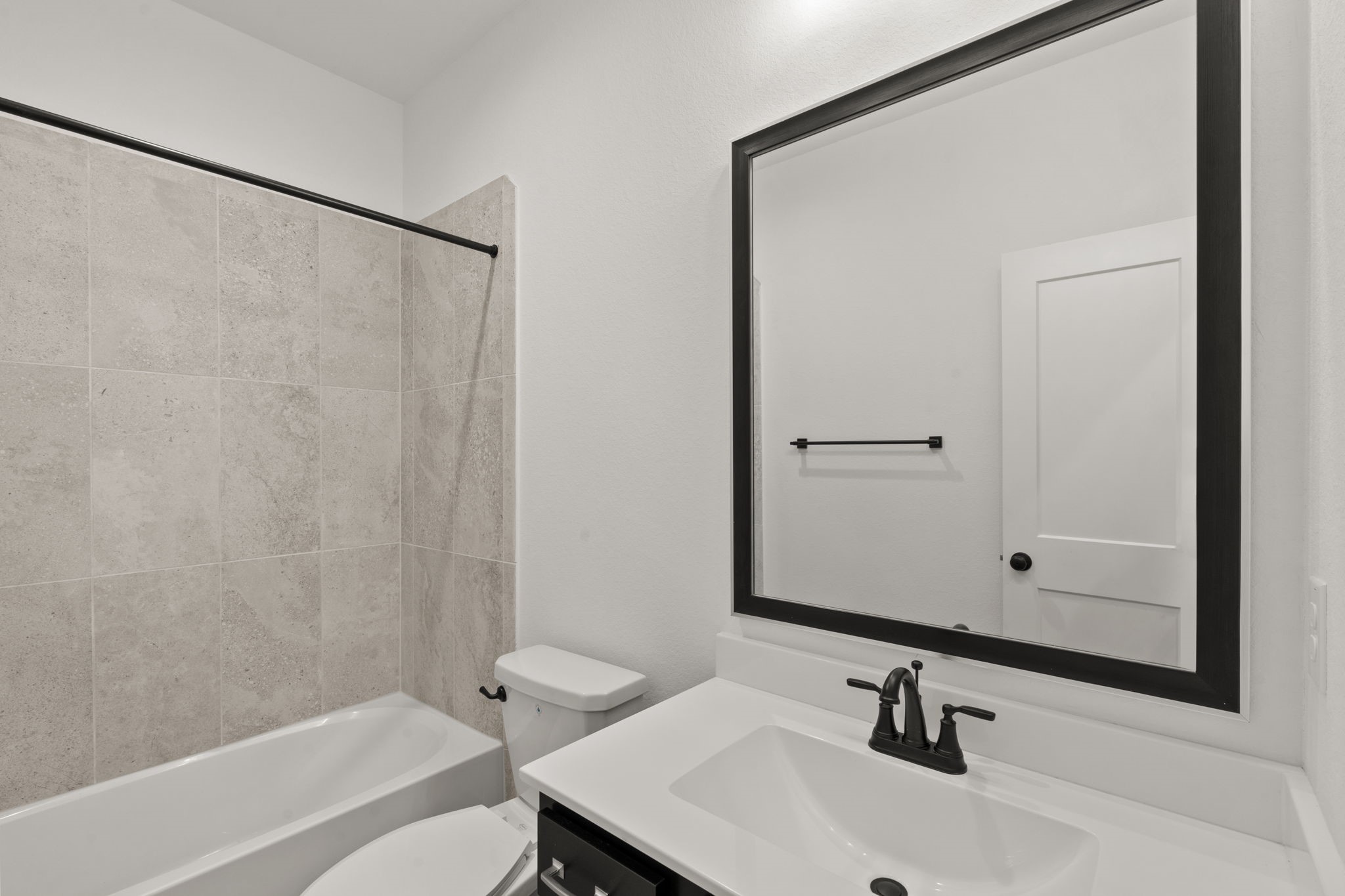 329 Rock Rose Path Willis, TX 77318 - Photo 12 of 36 a bathroom with a sink and a mirror